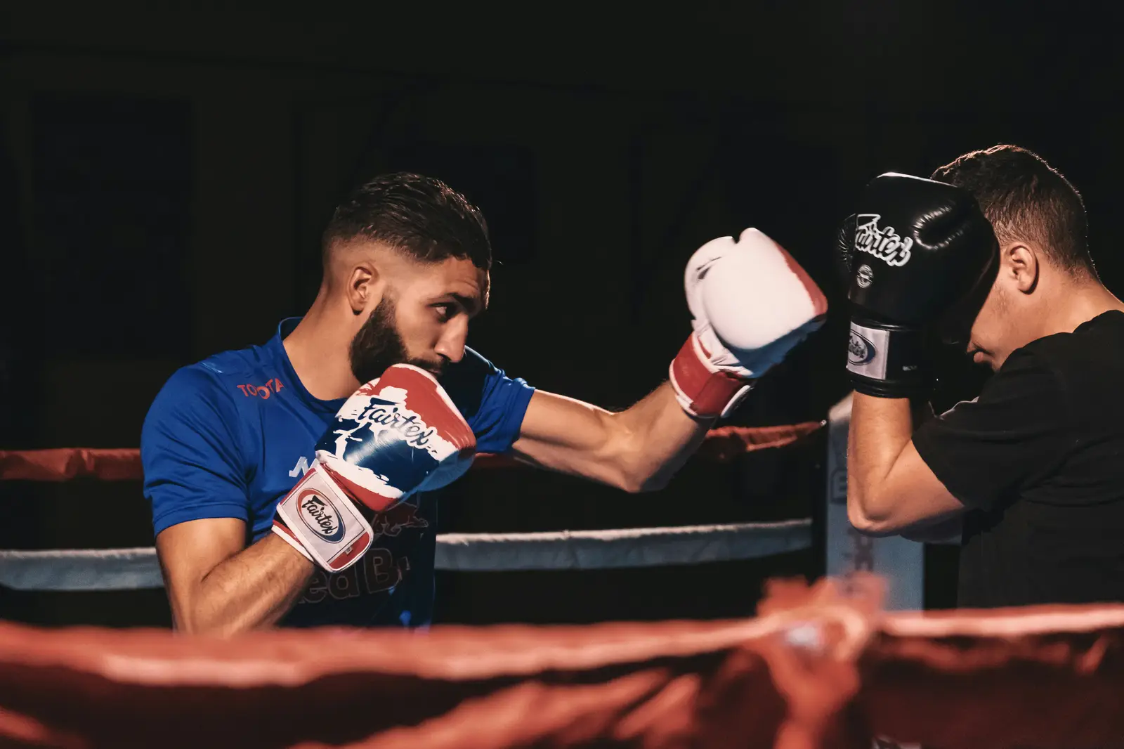 Boxer throwing a jab in the ring