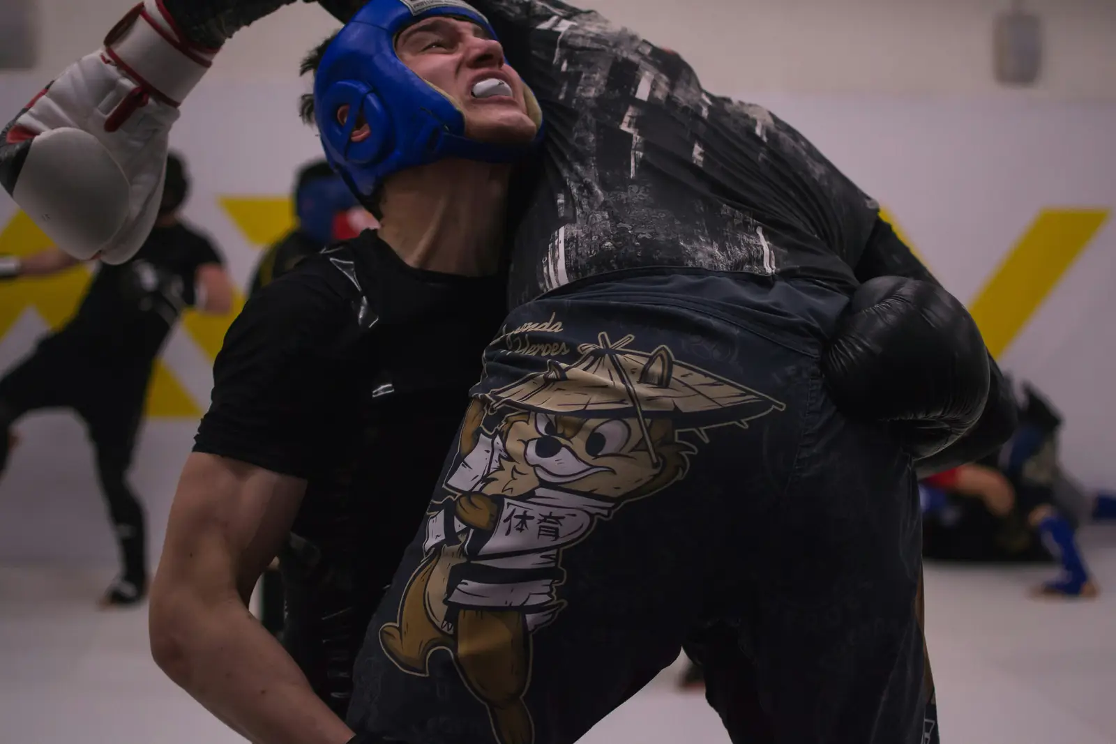 Two fighters in the clinch during sparring