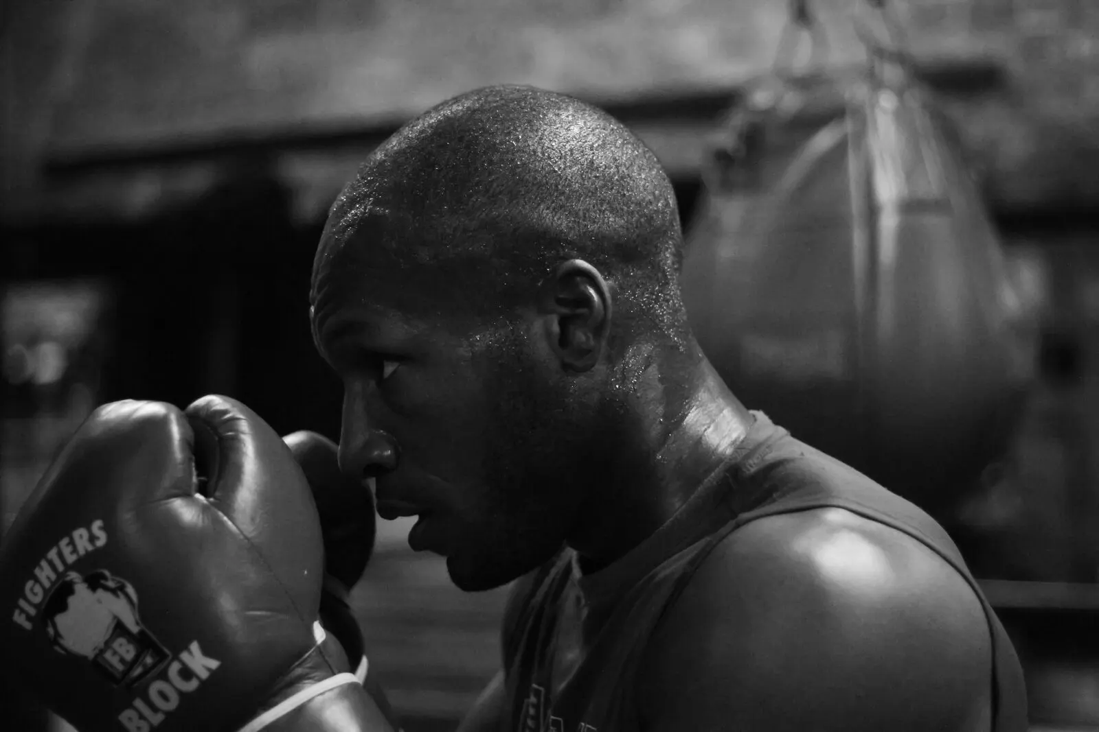 Boxer with gloves up in a gym