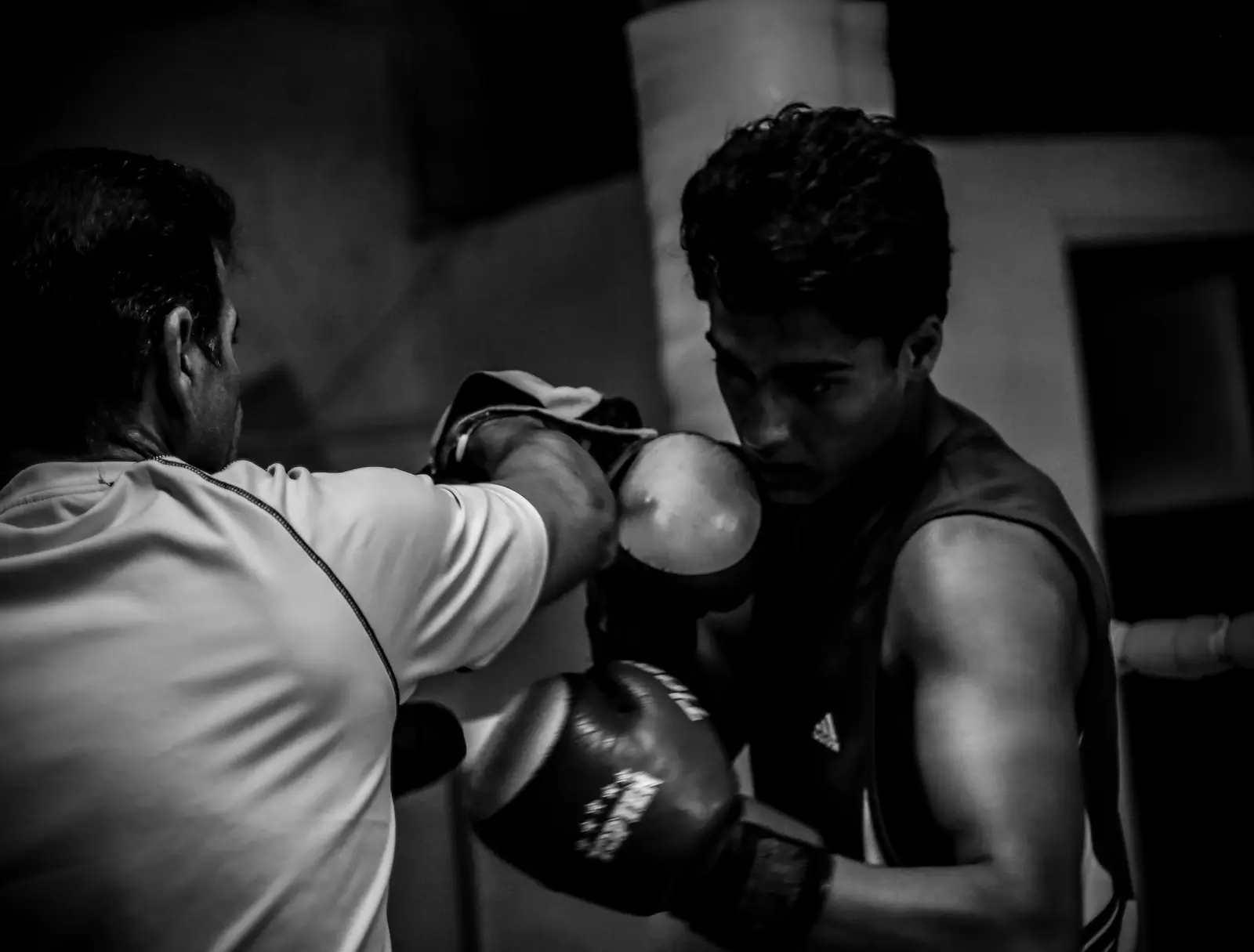 Boxer hitting pads with his coach